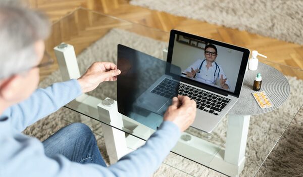 close-up-patient-talking-online-doctor-scaled-1